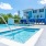 a swimming pool with a building in the background
