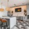 a kitchen with a table and chairs