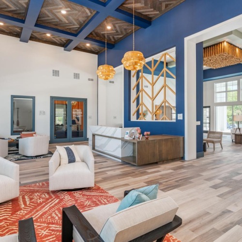 a living room with a large blue and white ceiling