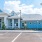 a large white building with a parking lot in front of it