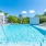 a swimming pool with a building in the background